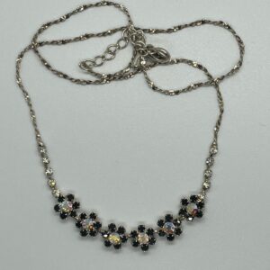 Silver chain necklace with black and crystal floral design